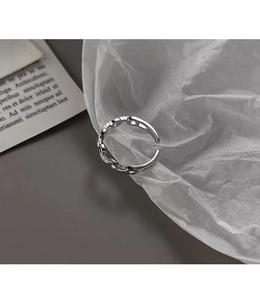 Macro detail of silver minimalist chain ring with geometric link design and polished finish
