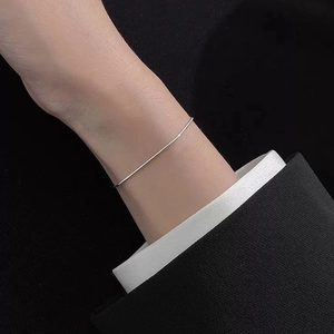 Minimalist S925 sterling silver snake bone chain bracelet worn on a woman's wrist