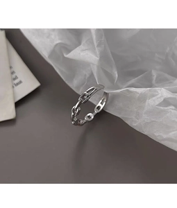 Detailed view of S925 sterling silver chain ring on minimalist grey and white background