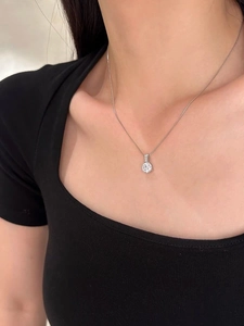 Close-up of S925 sterling silver necklace with a single sparkling cubic zirconia stone