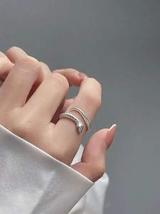 Close-up of S999 silver snake ring with scale texture and open adjustable design