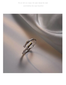 Detailed close-up of S925 silver bamboo-style ring with gold accents and open-band texture