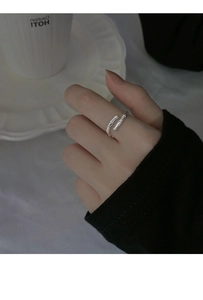 Macro shot of S925 sterling silver ring with natural branch texture on a model's hand