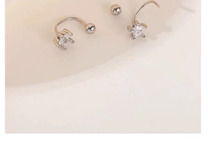 Detail view of S925 silver star screw-back studs with sparkling clear zircon inlay
