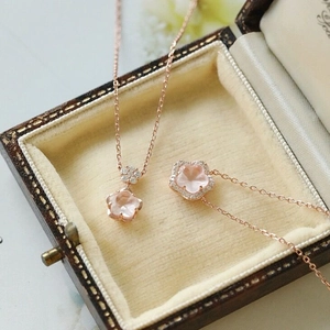 Rose gold S925 sterling silver necklace with a pink cherry blossom pendant and zircon stones