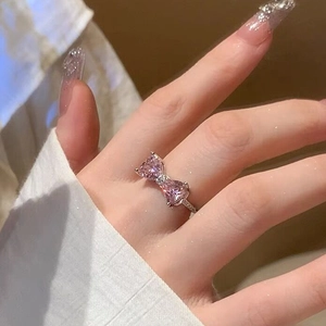 S925 sterling silver ring featuring a pink bow tie design with heart-shaped pink stones