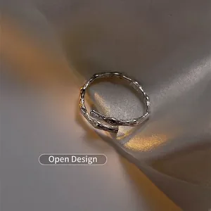 Adjustable S925 sterling silver ring with unique branch texture on white silk fabric