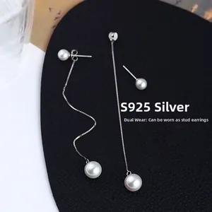 Détail de boucles d'oreilles perles en argent S925 avec longs fils et puces amovibles