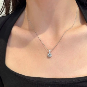 Elegant S925 silver necklace featuring a sparkling solitaire pendant on a thin snake chain