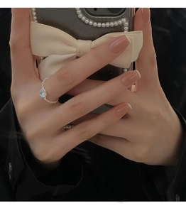 Close-up of S925 sterling silver chain ring with iridescent blue moonstone