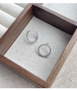Detailed view of S925 sterling silver hoop earrings with pavé set cubic zirconia