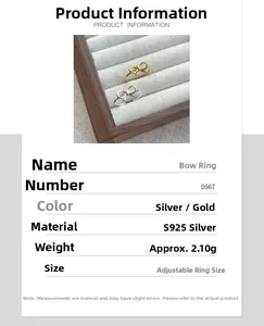 Detail view of S925 sterling silver bow rings with size and 2.10g weight specifications