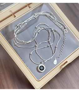 Detail of S925 sterling silver chain with black onyx pendant and S925 hallmark stamp