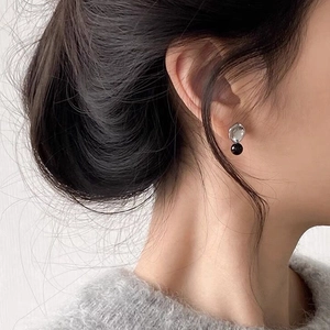 Minimalist S925 silver stud earrings with black onyx bead on an irregular metal base