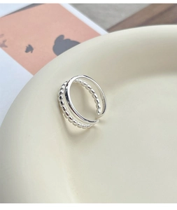 Detail of S925 sterling silver stamp on minimalist double-layered chain ring for women