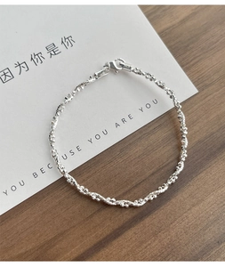 Detailed macro of S925 sterling silver beaded bracelet with lobster clasp and S925 stamp