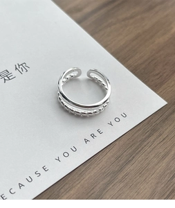 Detail view of adjustable S925 sterling silver double-layer ring with beaded texture