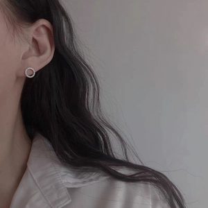 Sparkling S925 sterling silver hoop earrings with pavé crystals on a female model
