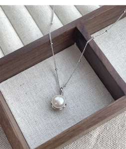 Close-up of a high-luster 8mm freshwater pearl on an S925 sterling silver bead chain