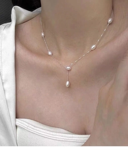 Elegant S925 silver necklace with teardrop freshwater pearls on model for women