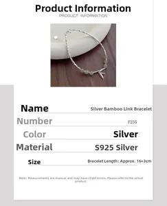 Detail view of S925 sterling silver bamboo style bracelet with green jade beads and charms