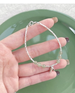 Close-up of S925 sterling silver bamboo joint bracelet with green Hetian jade beads