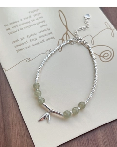Detailed close-up of S925 silver bamboo-style bracelet with green jade beads and leaf charm