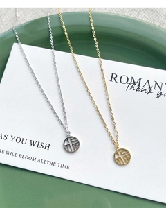 Detailed view of silver and gold S925 necklaces with hollow Fu character pendants