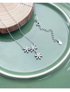 Detailed macro view of S925 silver snowflake necklace with clear zircon inlay crystals