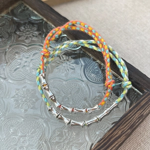 Set of 2 handcrafted S925 silver bamboo-style woven bracelets in vibrant ethnic colors