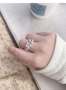Lifestyle shot of S925 sterling silver beaded cluster ring with reflective faceted balls