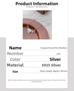 Detail view showing S925 sterling silver irregular discs on a snake bone chain necklace