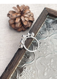 Detailed view of S925 sterling silver grape cluster ring with movable silver beads