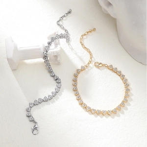 Minimalist heart chain anklet in gold and silver finish with sparkling crystal paving stones