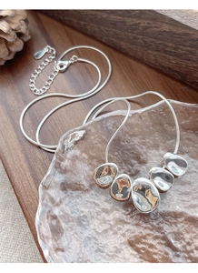 Polished S925 sterling silver snake chain with five irregular pebble-shaped pendants
