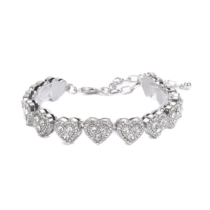 Detail of silver heart anklet featuring pavé crystal links and adjustable lobster clasp