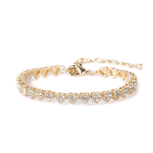 Macro detail of golden heart chain anklet with sparkling zircon pave and lobster clasp