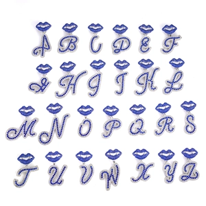Full set of crystal-studded A-Z alphabet pendants with blue lip-shaped top design