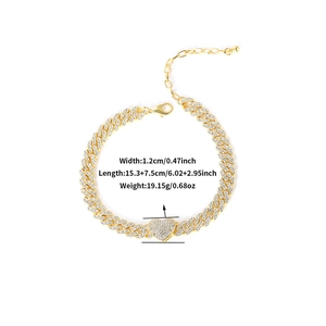 Golden Cuban link anklet with iced-out heart charm and lobster clasp on white background
