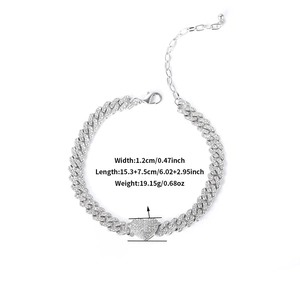 Silver Cuban chain bracelet with iced out heart pendant and sparkling rhinestones