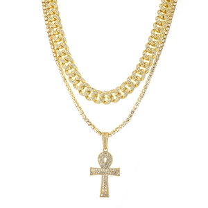 Close-up of gold-plated double-layer hip-hop necklace with iced out Ankh cross pendant
