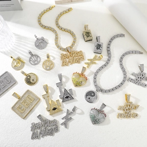 Collection of iced out hip-hop jewelry pendants with cubic zirconia and tennis chains