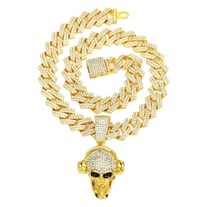Iced out Cuban chain with hip hop skull pendant wearing headphones in gold finish