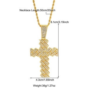 Detail of large gold cross pendant with white zircon inlays and 20 inch rope chain