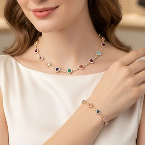 Conjunto de collar y pulsera tennis con circonitas de corazones en acabado oro