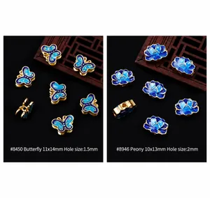 Detailed macro view of butterfly and peony enamel charms for DIY Chinese hairpins