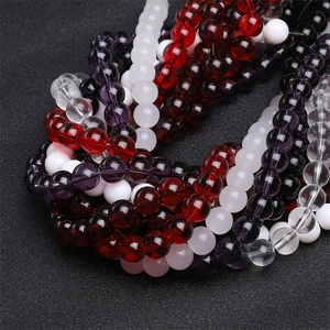 Detailed macro view of smooth multi-colored round glass beads for DIY jewelry making
