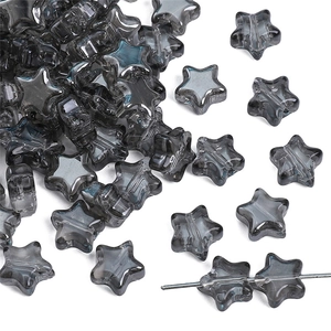 Macro shot of 8mm smoky grey star-shaped glass beads for handmade jewelry DIY projects