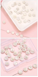 Macro detail of alphabet shell beads with gold lettering for DIY jewelry crafting