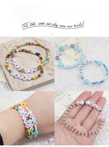 Detail of DIY bracelet set with acrylic letter beads and colorful beads on a stone surface